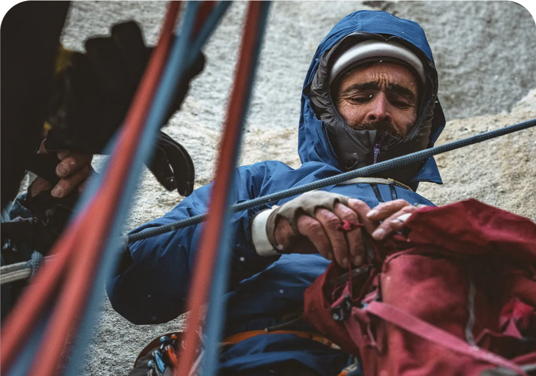 Patagonia Ambassador Sean Villanueva O'Driscoll digs for his daily ration on day 15 of Riders on the Storm.
