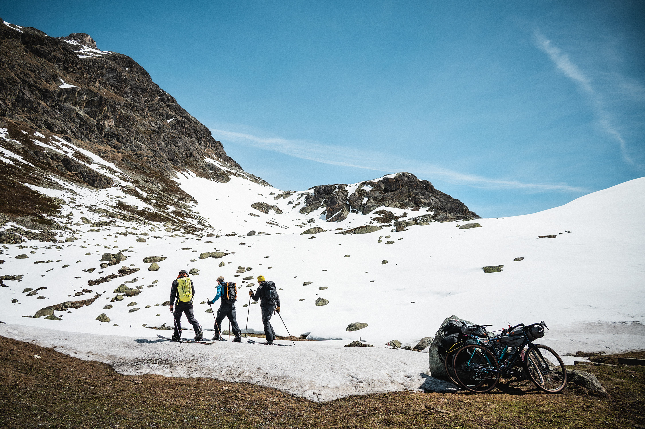 Your winter. Your choice. Group of three ski touring in the mountains.