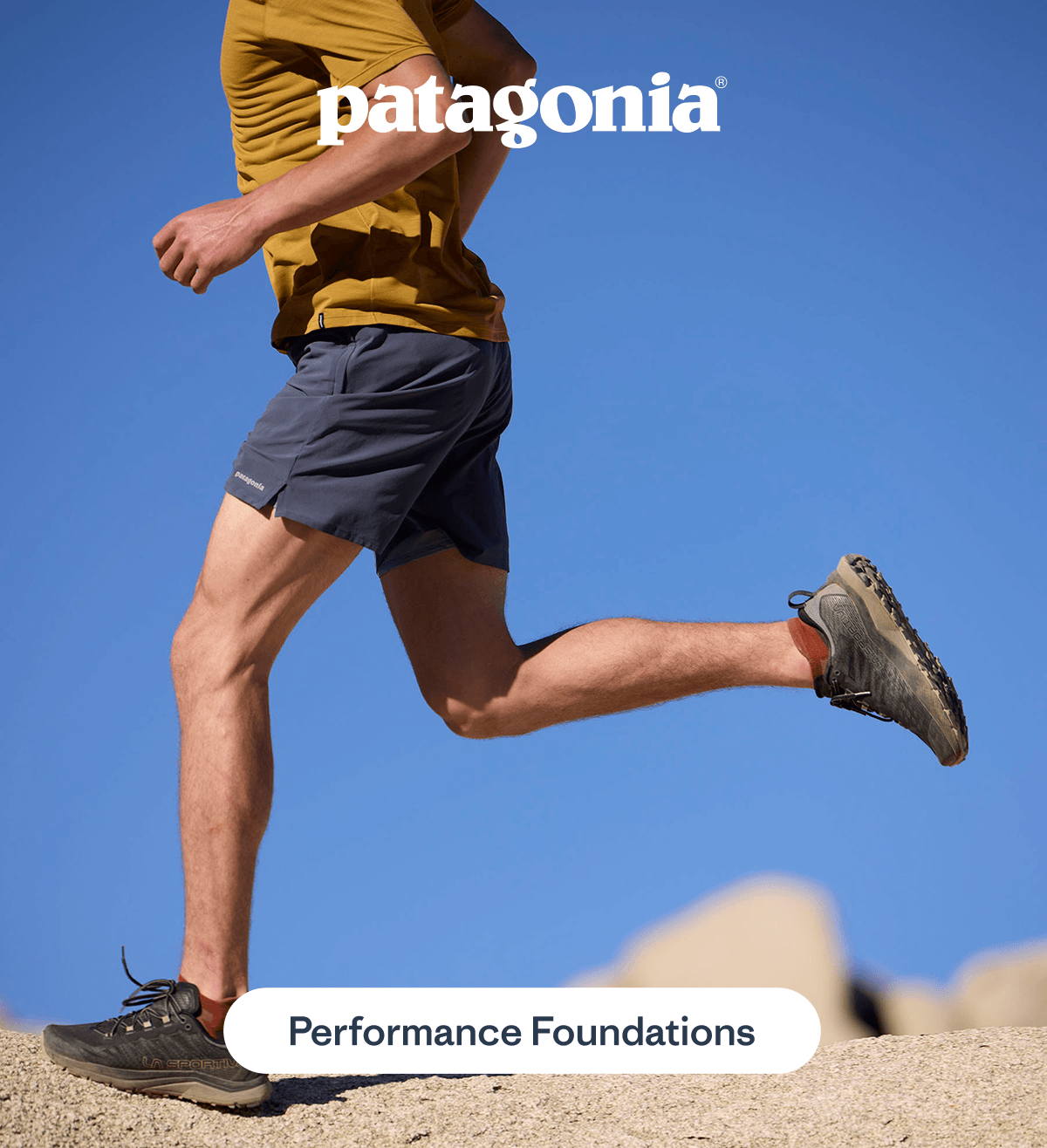 Runner wearing Patagonia shorts and trail shoes mid-jump outdoors