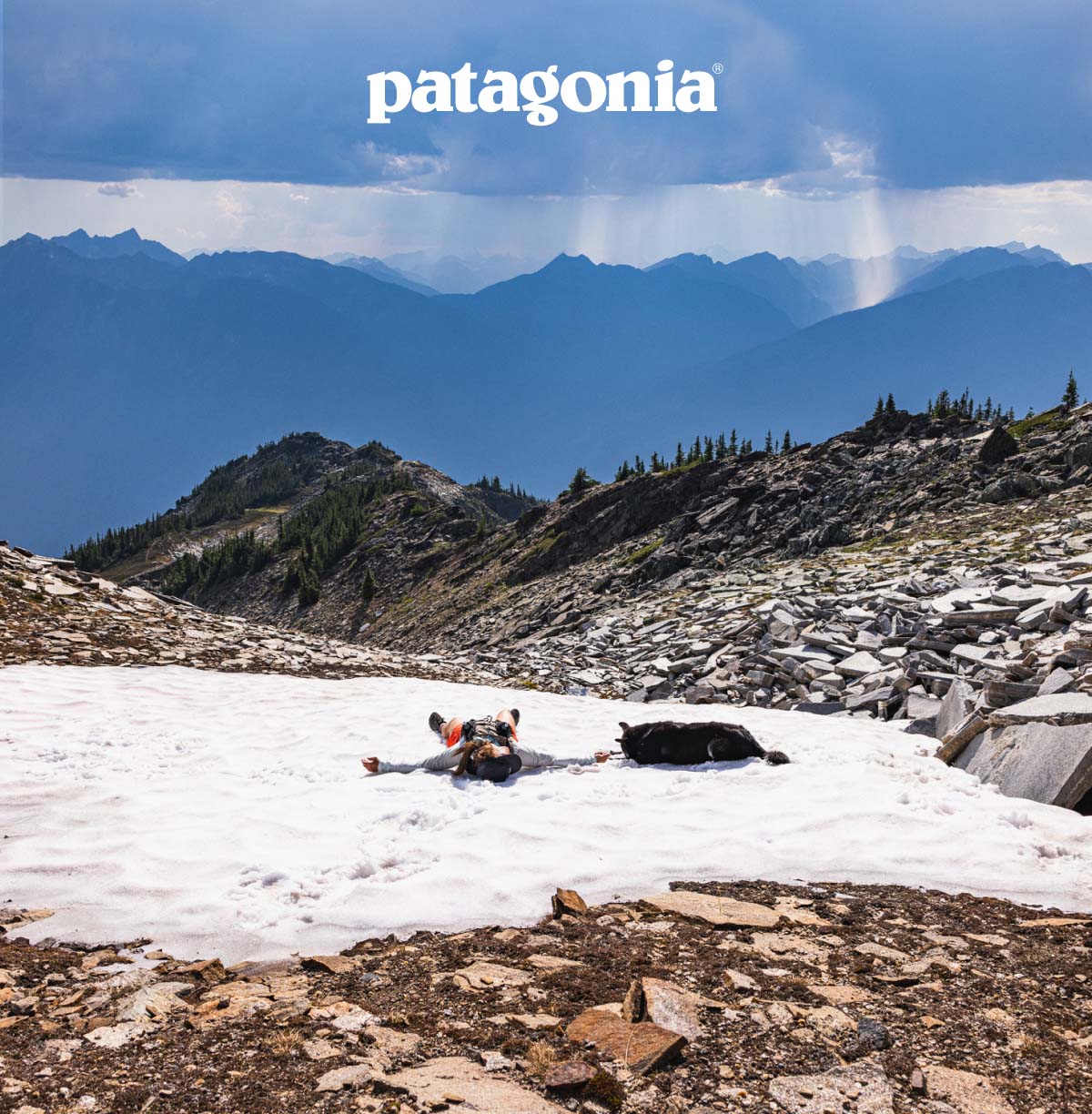 Patagonia. A person rests in the shade of a truck.
