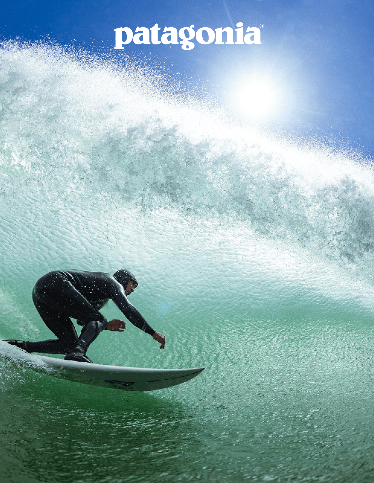 A surfer pulls in to a backlit tube.